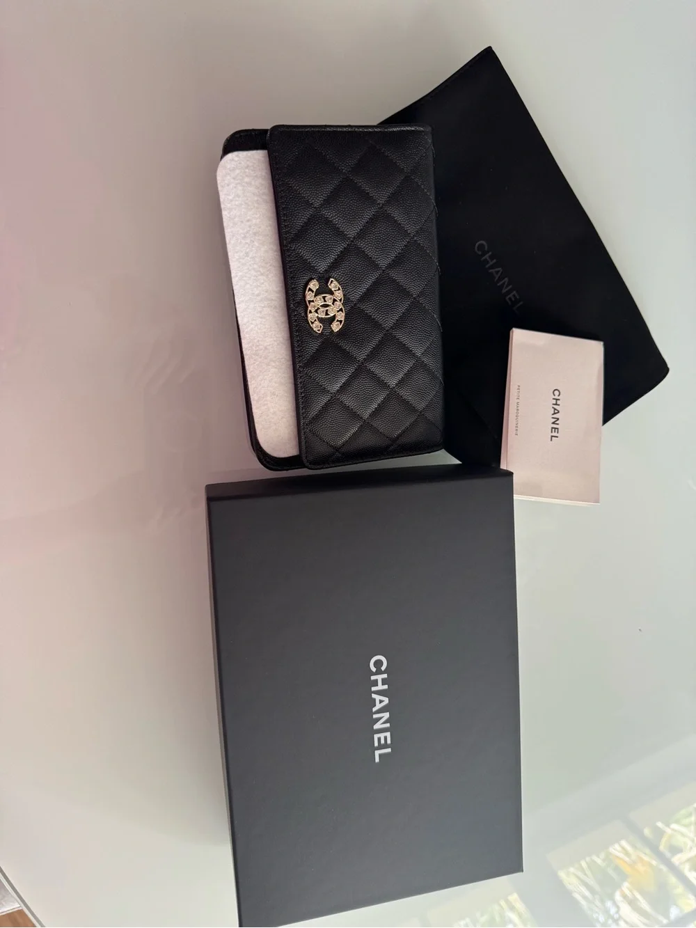 CHANEL WOC Black caviar leather with Gold Hardware and heart shaped crystal logo